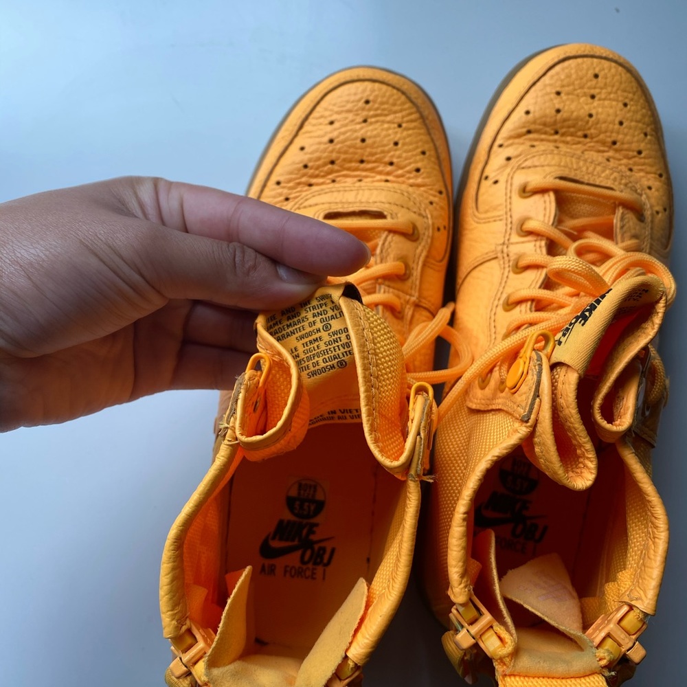 Neon orange Nike hightop air force’s